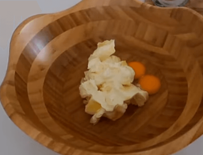 Butter, eggs, oil, vinegar, salt, and sugar combined in a bowl