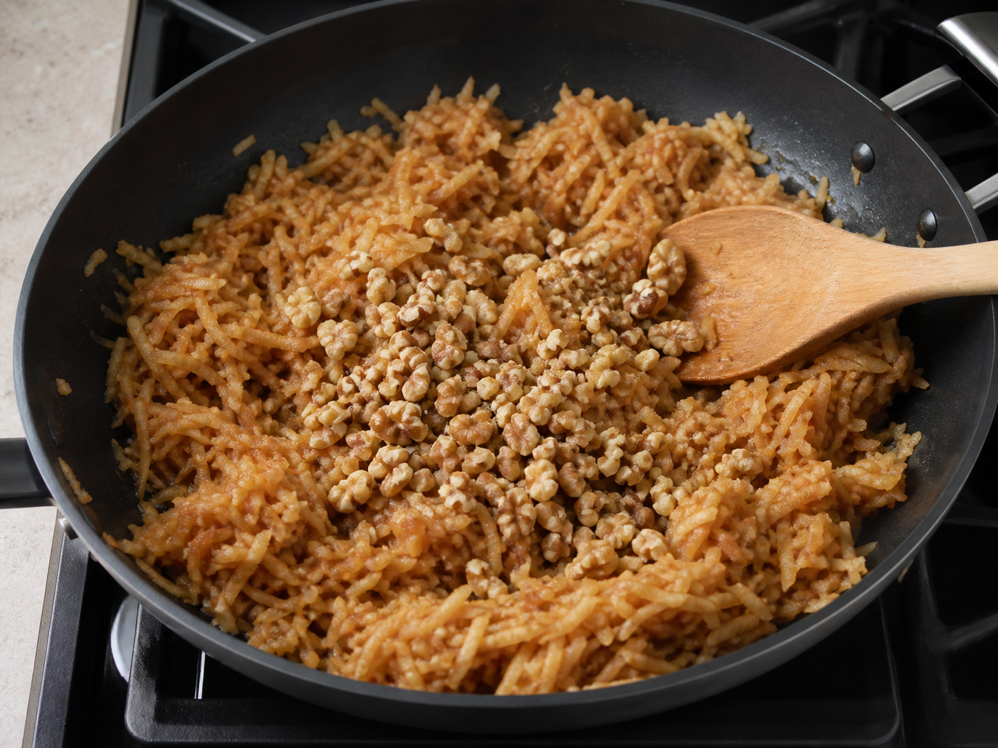 Cinnamon and chopped walnuts mixed into the cooked apple filling