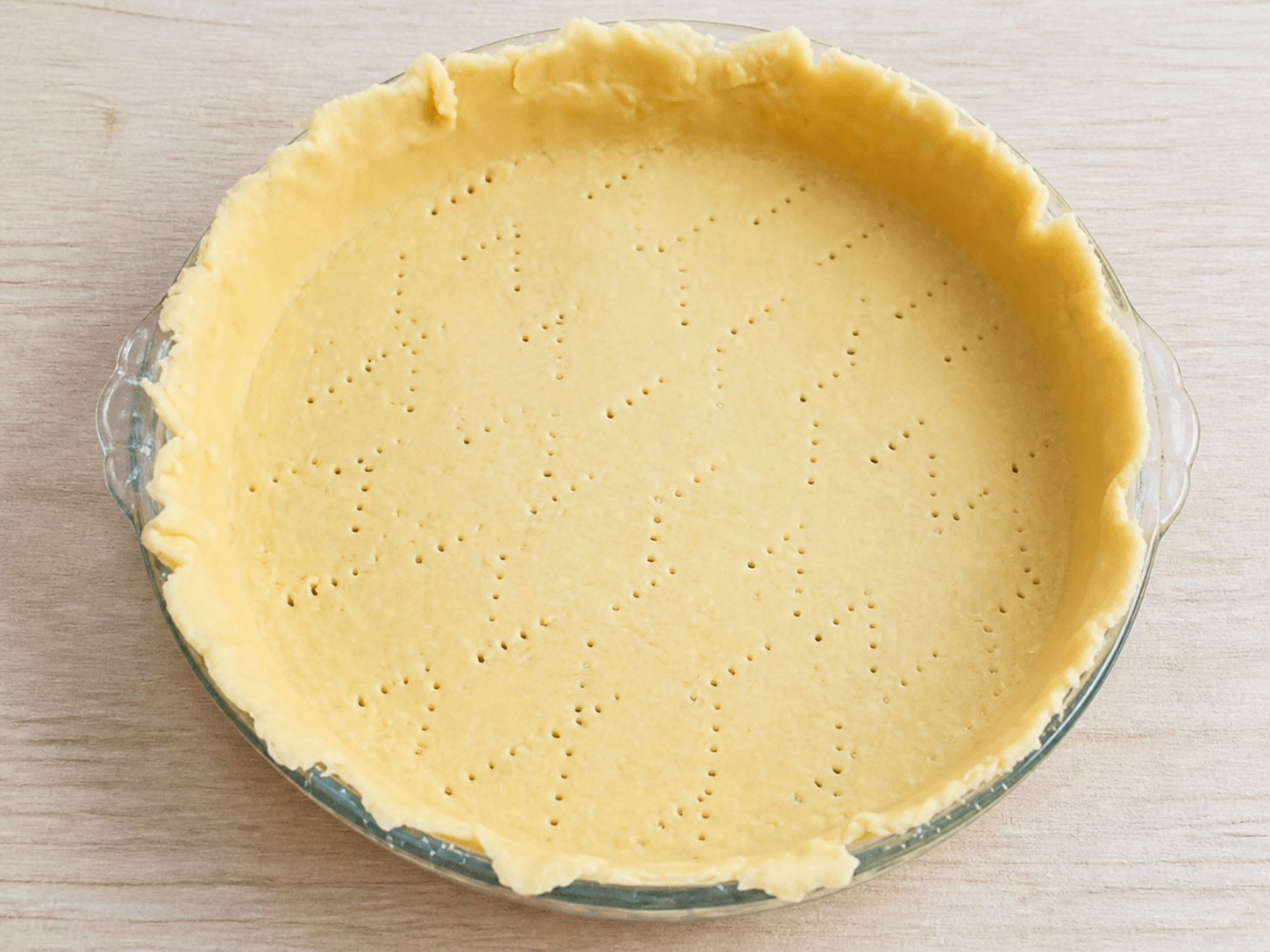 Pastry dough pressed evenly into a round pie dish