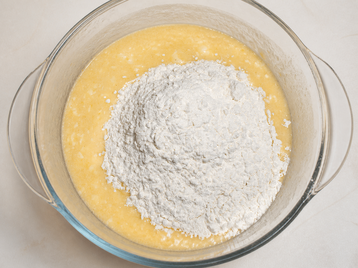 Flour added to the orange cake batter