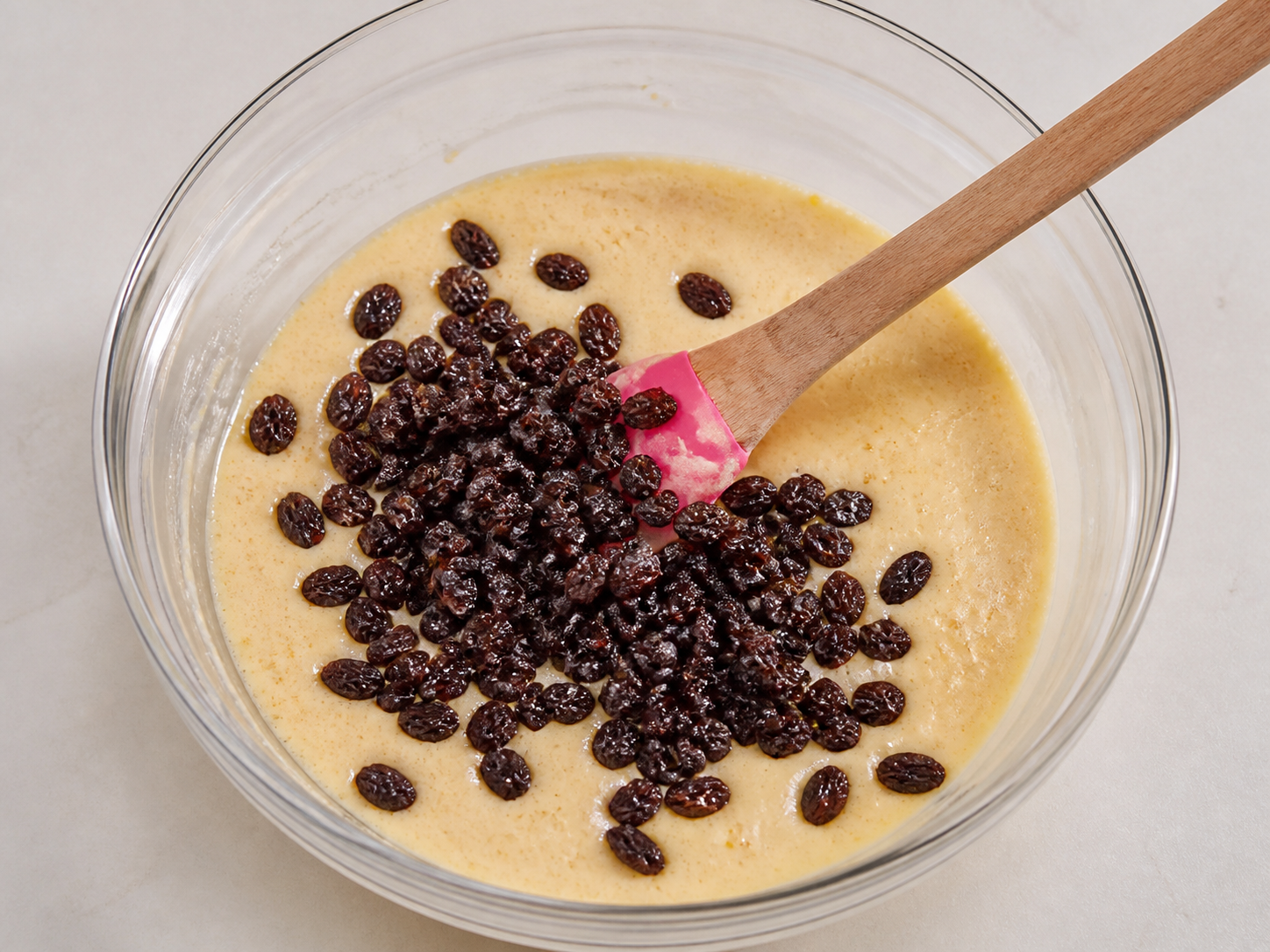 Raisins folded into the orange cake batter